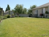 Fenced backyard with curbing
